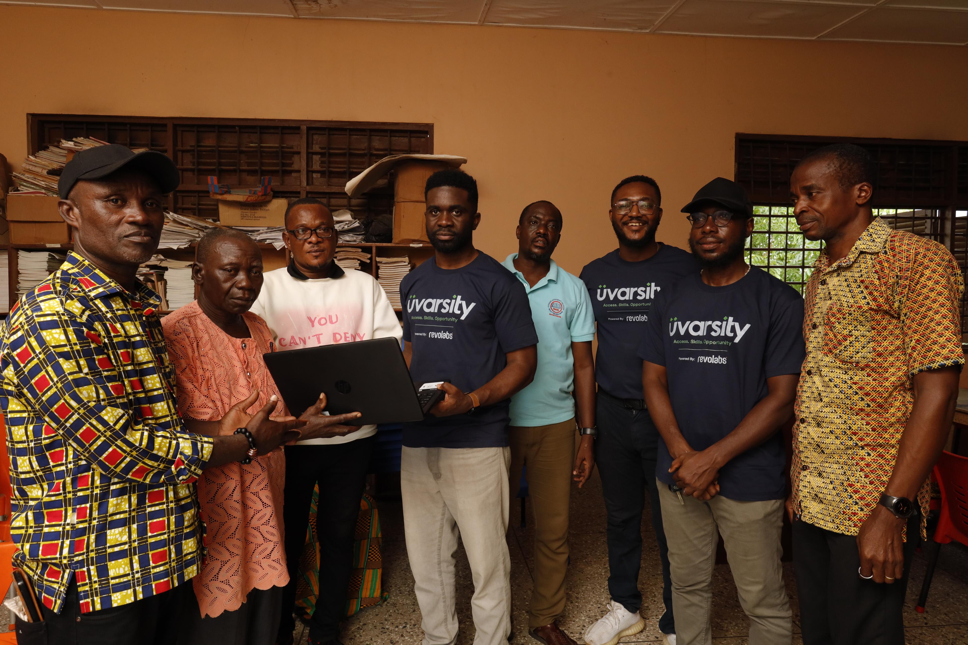 RevoLabs team presenting donated laptops for rural schools